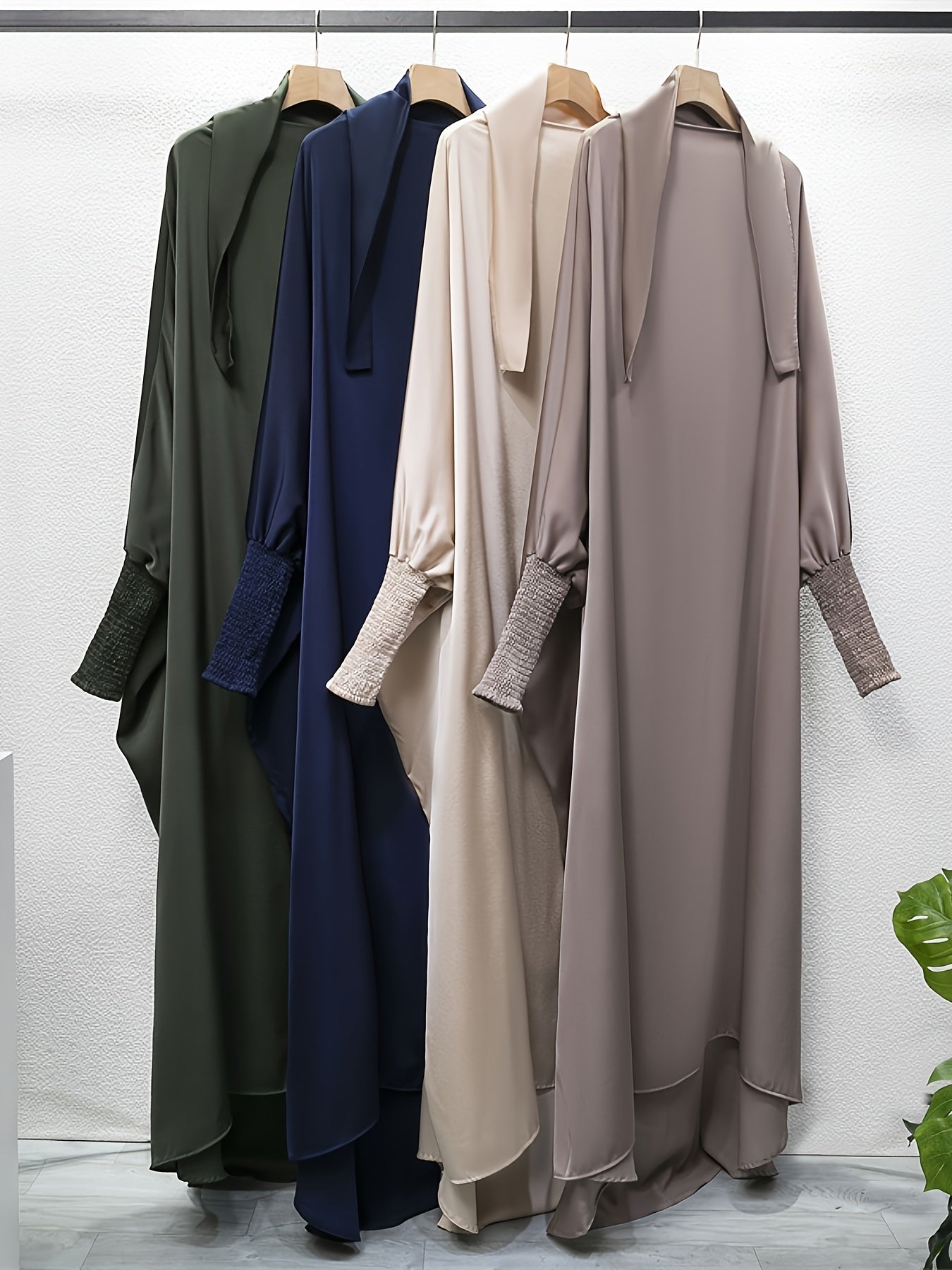 Women's One-Piece Prayer Jilbaab Dress Featuring a Hooded Design And Smocking Sleeves, Suitable for Islamic Attire, Available in Black, Inspired by Turkish Modest Fashion.