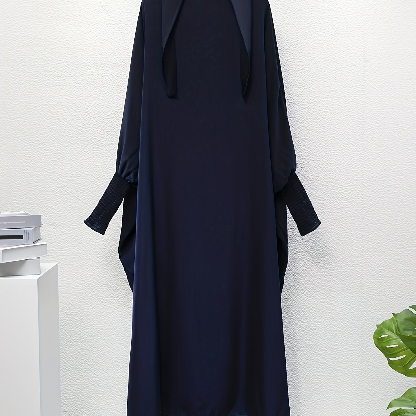 Women's One-Piece Prayer Jilbaab Dress Featuring a Hooded Design And Smocking Sleeves, Suitable for Islamic Attire, Available in Black, Inspired by Turkish Modest Fashion.