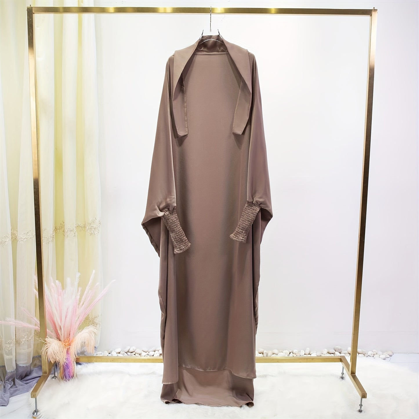 Women's One-Piece Prayer Jilbaab Dress Featuring a Hooded Design And Smocking Sleeves, Suitable for Islamic Attire, Available in Black, Inspired by Turkish Modest Fashion.