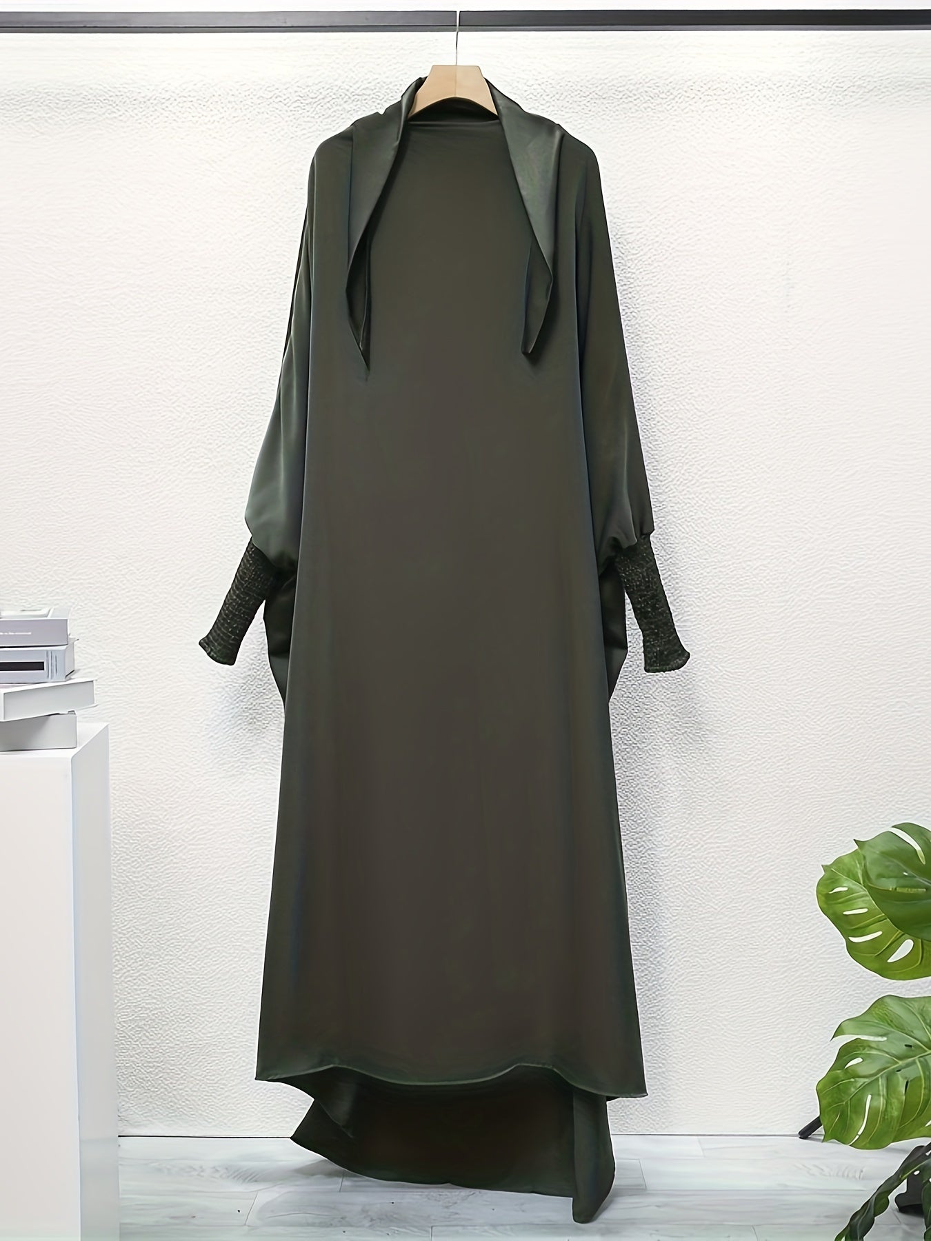Women's One-Piece Prayer Jilbaab Dress Featuring a Hooded Design And Smocking Sleeves, Suitable for Islamic Attire, Available in Black, Inspired by Turkish Modest Fashion.
