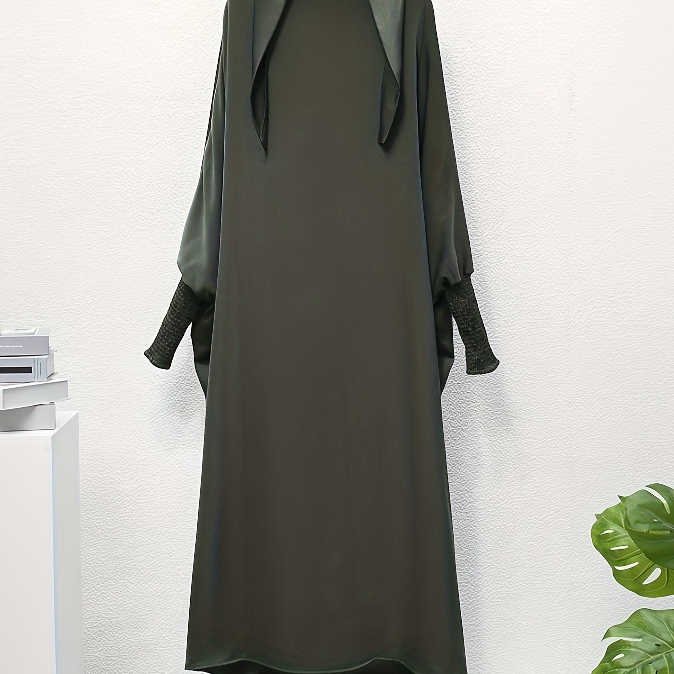 Women's One-Piece Prayer Jilbaab Dress Featuring a Hooded Design And Smocking Sleeves, Suitable for Islamic Attire, Available in Black, Inspired by Turkish Modest Fashion.