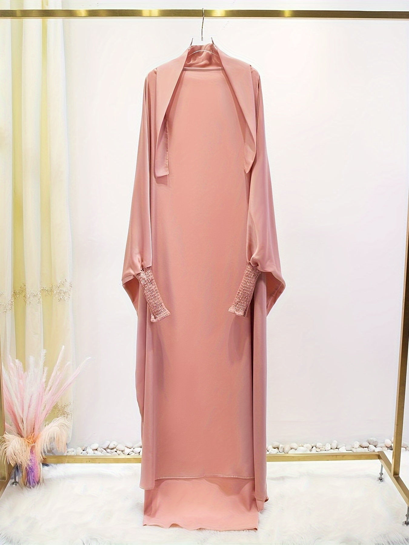 Women's One-Piece Prayer Jilbaab Dress Featuring a Hooded Design And Smocking Sleeves, Suitable for Islamic Attire, Available in Black, Inspired by Turkish Modest Fashion.