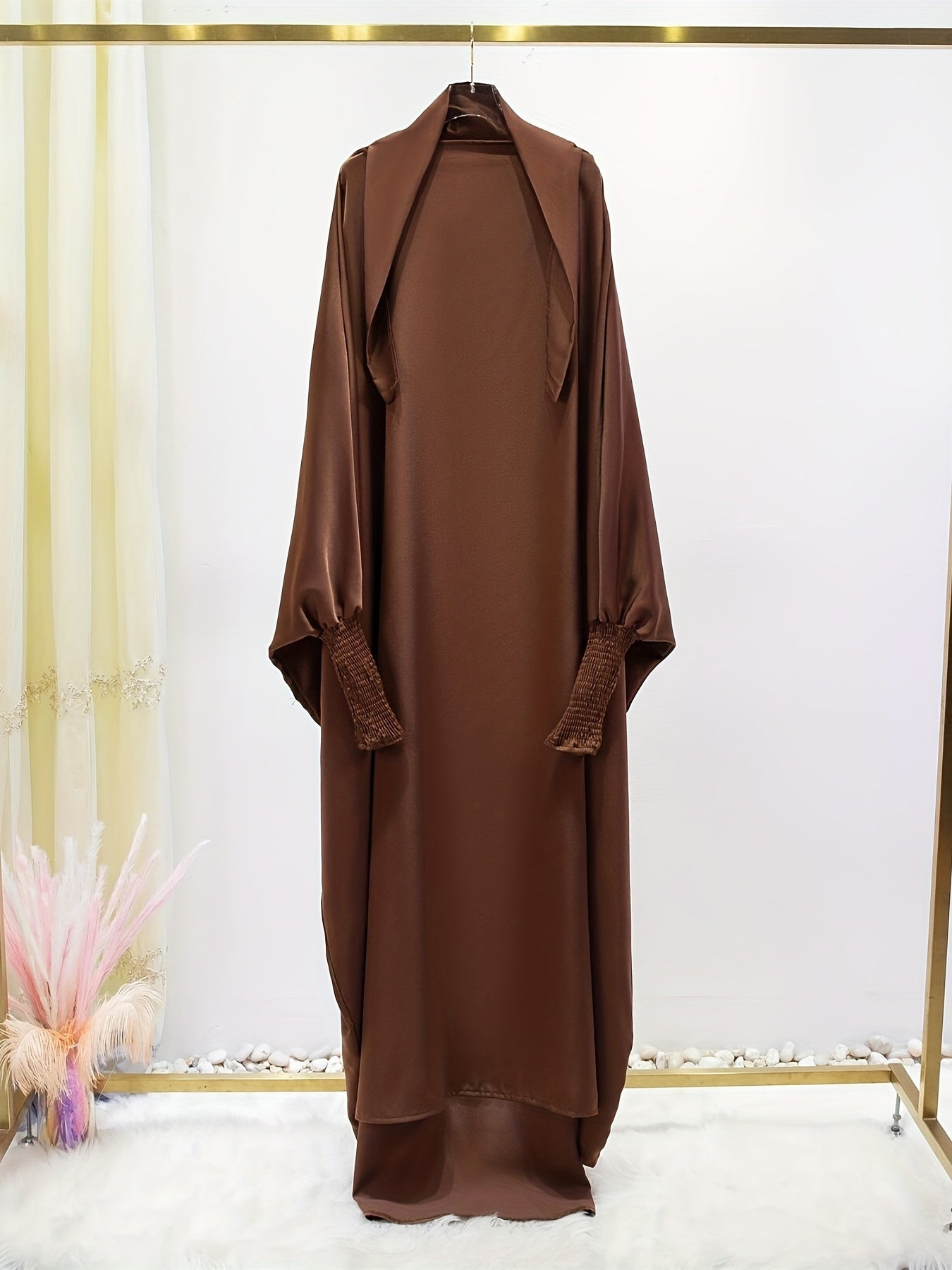 Women's One-Piece Prayer Jilbaab Dress Featuring a Hooded Design And Smocking Sleeves, Suitable for Islamic Attire, Available in Black, Inspired by Turkish Modest Fashion.