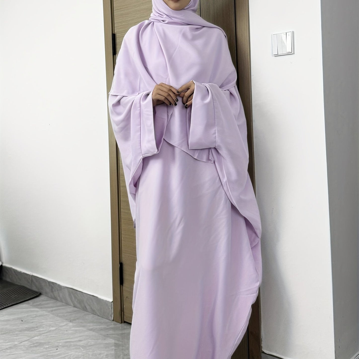 Set of 2 Muslim Jibab Abaya Dresses Featuring a Crew Neck And Batwing Sleeves, Including Hijabs, Designed for Women. These Loose-Fitting Maxi Dresses Are Suitable for Prayer And Everyday Wear.