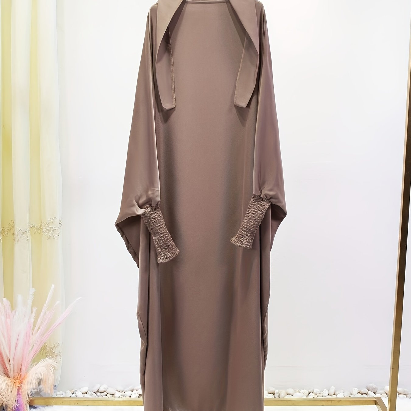 Women's One-Piece Prayer Jilbaab Dress Featuring a Hooded Design And Smocking Sleeves, Suitable for Islamic Attire, Available in Black, Inspired by Turkish Modest Fashion.
