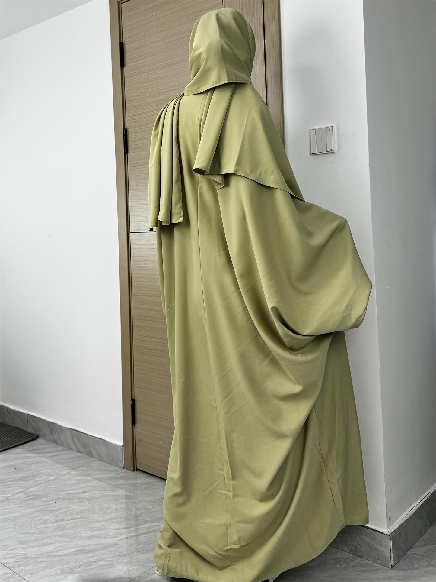Set of 2 Muslim Jibab Abaya Dresses Featuring a Crew Neck And Batwing Sleeves, Including Hijabs, Designed for Women. These Loose-Fitting Maxi Dresses Are Suitable for Prayer And Everyday Wear.