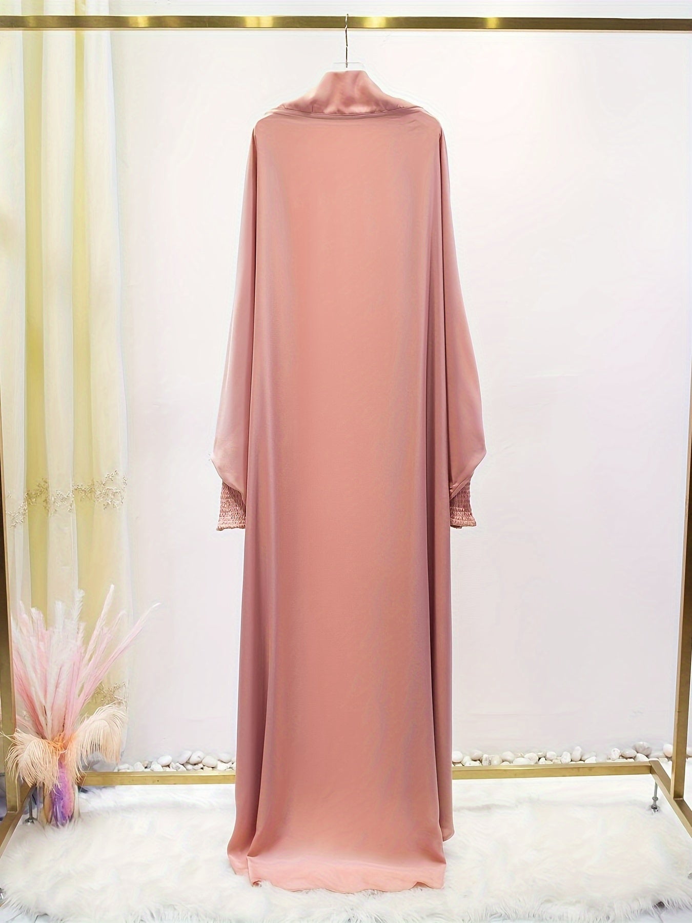 Women's One-Piece Prayer Jilbaab Dress Featuring a Hooded Design And Smocking Sleeves, Suitable for Islamic Attire, Available in Black, Inspired by Turkish Modest Fashion.