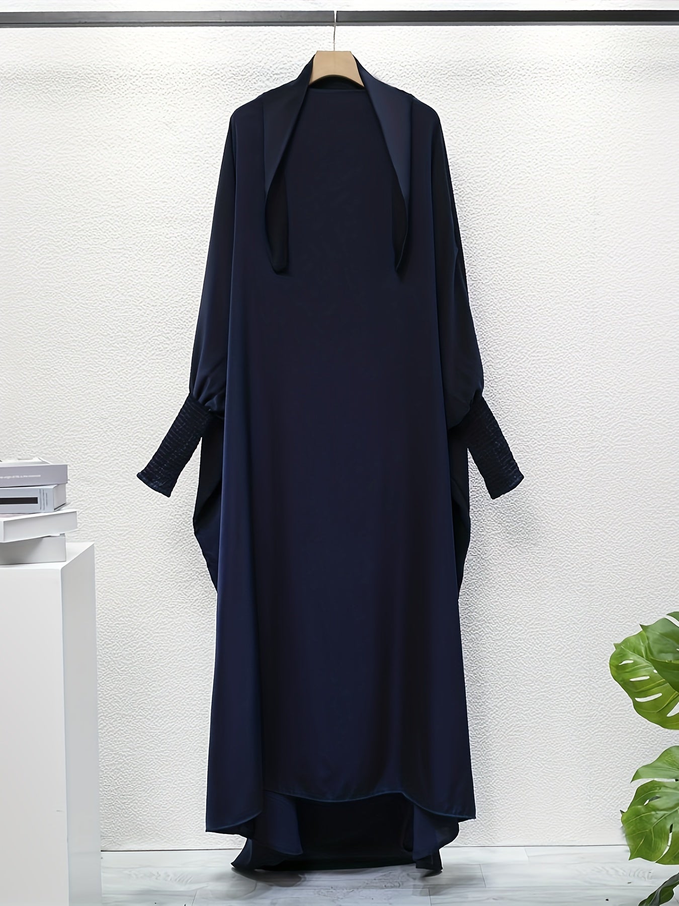 Women's One-Piece Prayer Jilbaab Dress Featuring a Hooded Design And Smocking Sleeves, Suitable for Islamic Attire, Available in Black, Inspired by Turkish Modest Fashion.