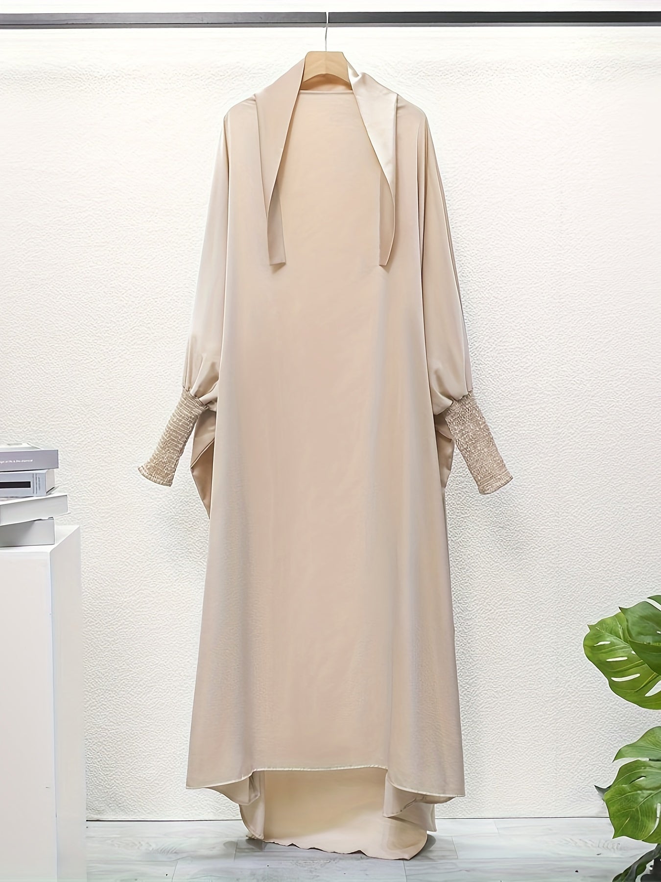 Women's One-Piece Prayer Jilbaab Dress Featuring a Hooded Design And Smocking Sleeves, Suitable for Islamic Attire, Available in Black, Inspired by Turkish Modest Fashion.