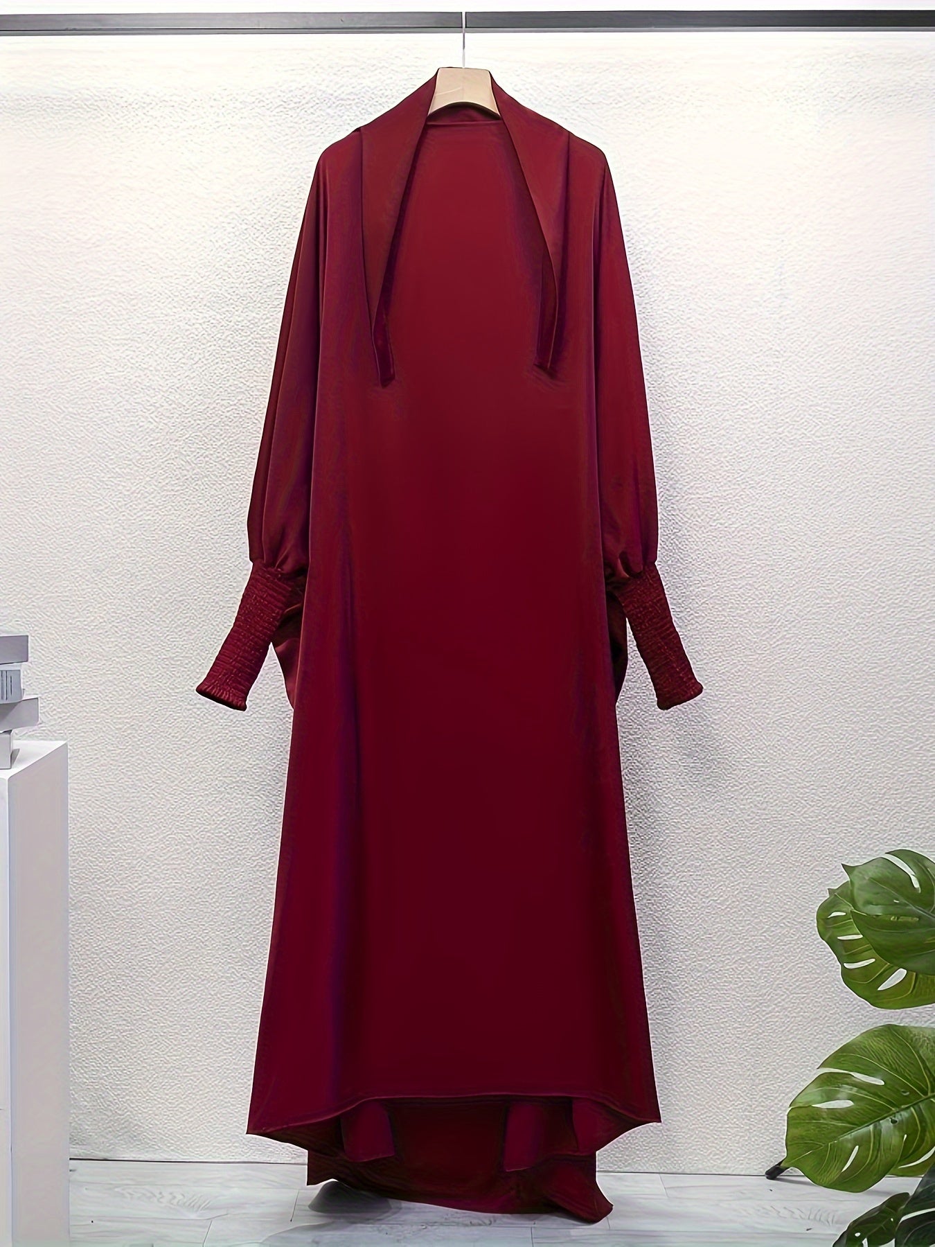 Women's One-Piece Prayer Jilbaab Dress Featuring a Hooded Design And Smocking Sleeves, Suitable for Islamic Attire, Available in Black, Inspired by Turkish Modest Fashion.