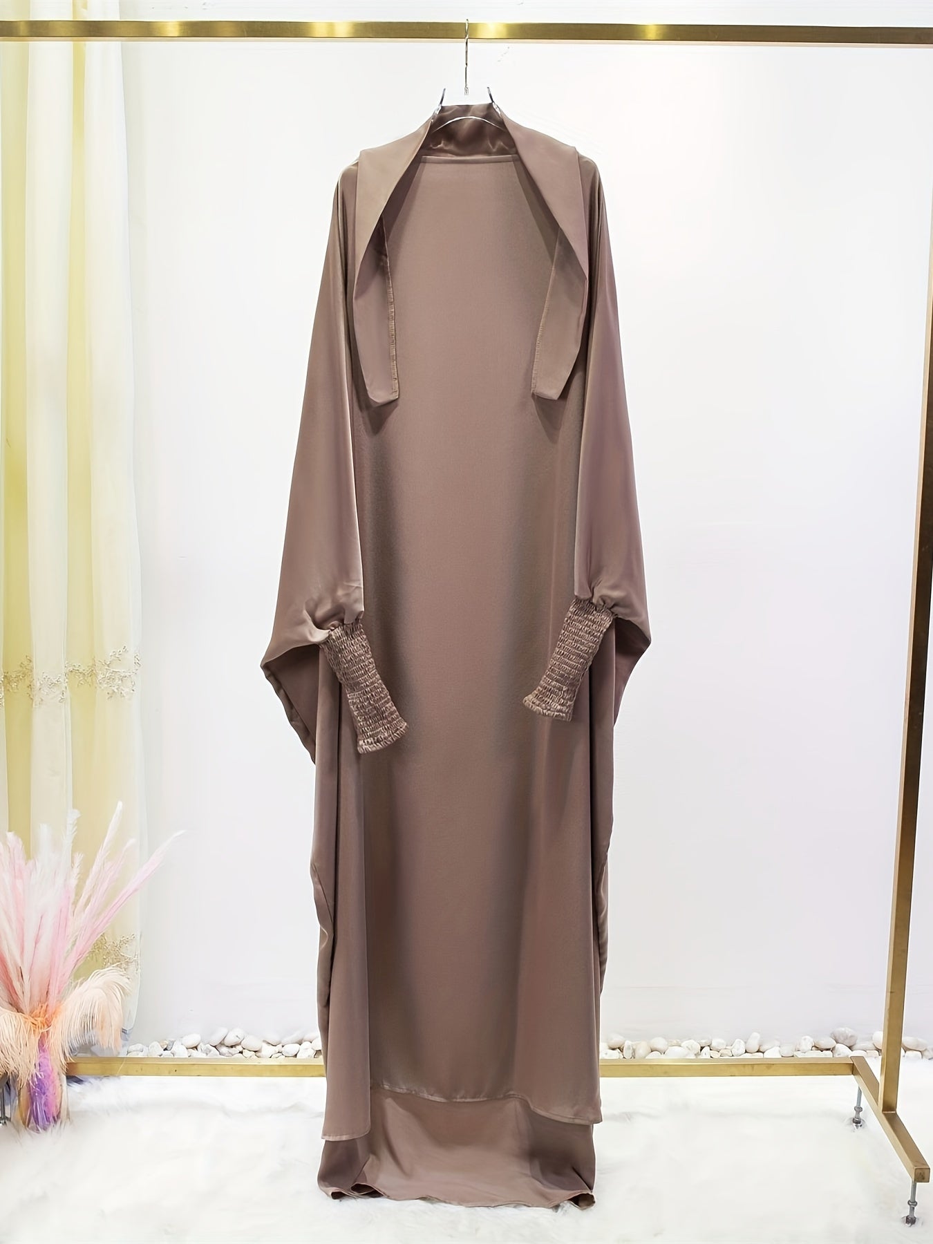Women's One-Piece Prayer Jilbaab Dress Featuring a Hooded Design And Smocking Sleeves, Suitable for Islamic Attire, Available in Black, Inspired by Turkish Modest Fashion.