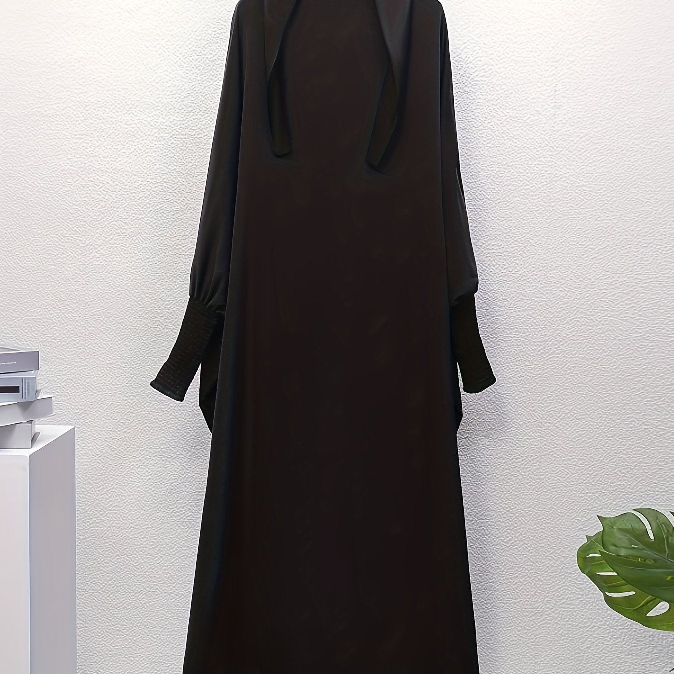 Women's One-Piece Prayer Jilbaab Dress Featuring a Hooded Design And Smocking Sleeves, Suitable for Islamic Attire, Available in Black, Inspired by Turkish Modest Fashion.