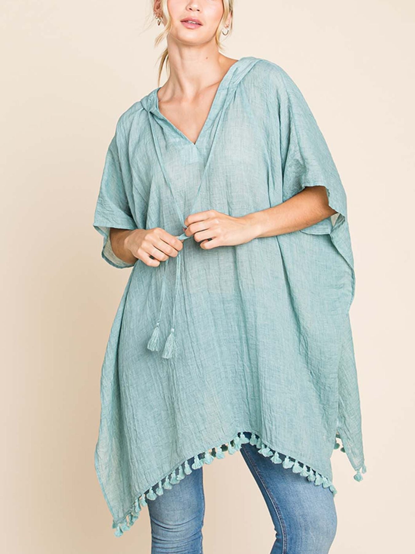 Lightweight And Flowy, This Oversized Kimono Wrap Features a Boho Chic Design with a Hood And Tassel Trim, Perfect for Summer Pool Days And Beach Vacations in Mint Green