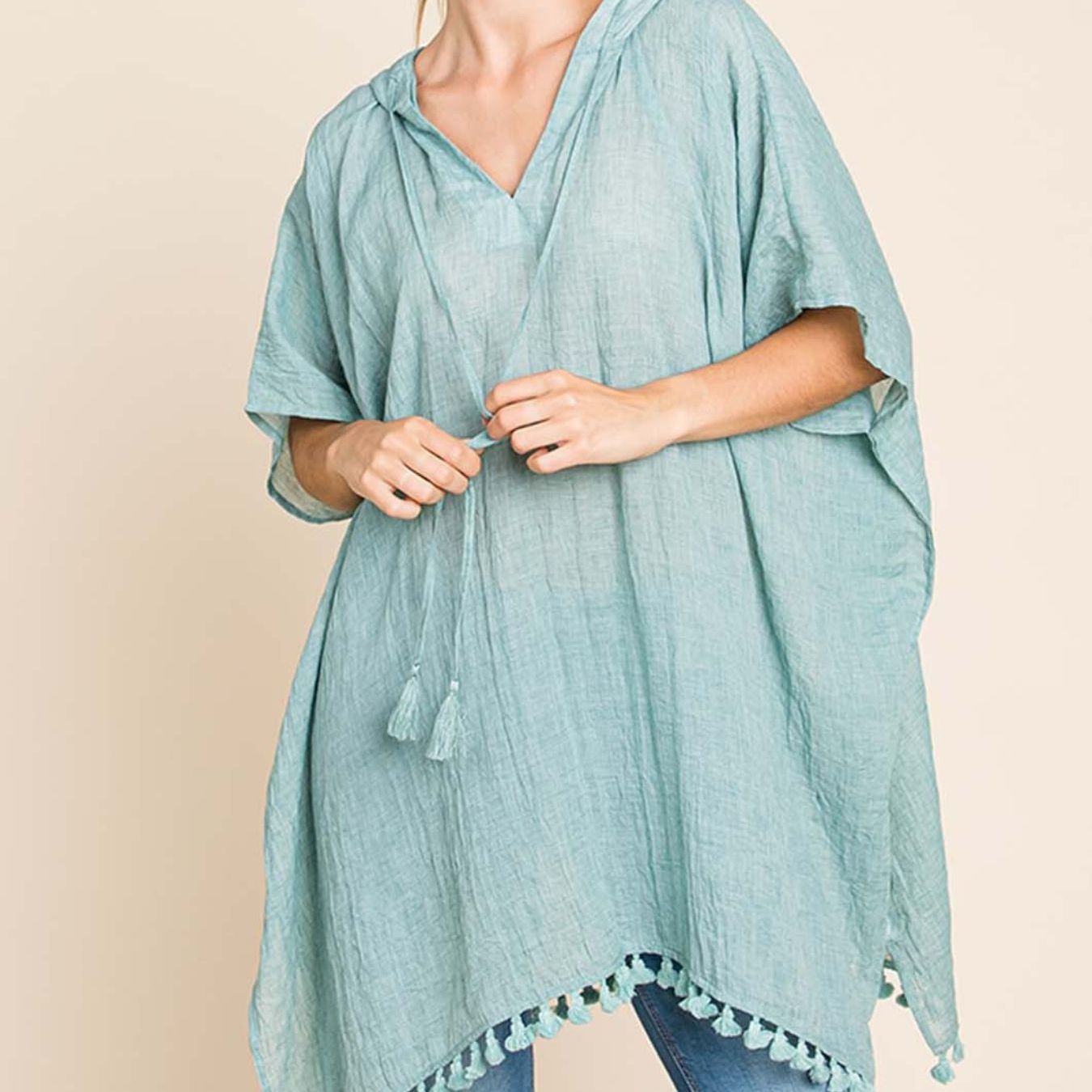Lightweight And Flowy, This Oversized Kimono Wrap Features a Boho Chic Design with a Hood And Tassel Trim, Perfect for Summer Pool Days And Beach Vacations in Mint Green