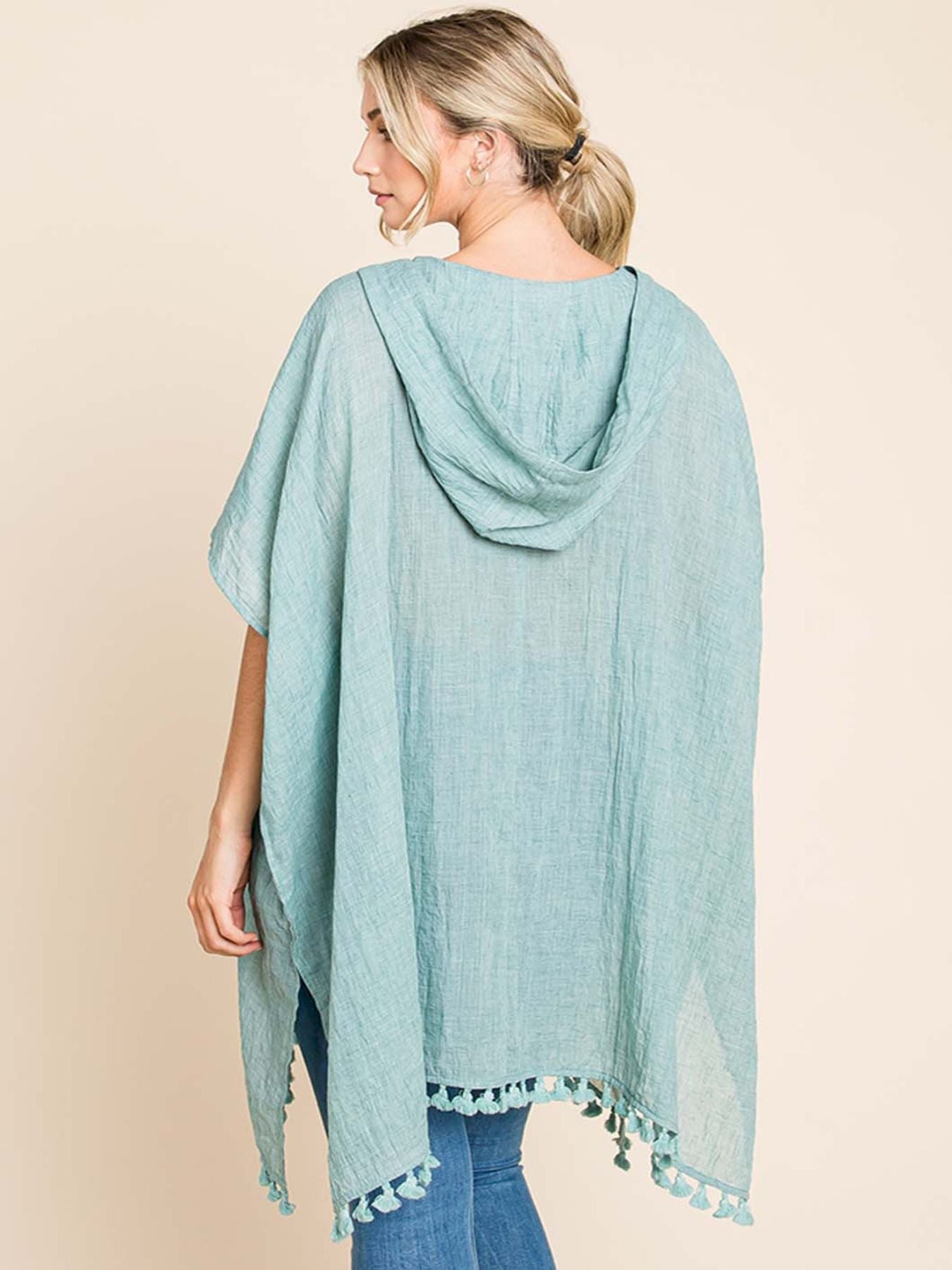 Lightweight And Flowy, This Oversized Kimono Wrap Features a Boho Chic Design with a Hood And Tassel Trim, Perfect for Summer Pool Days And Beach Vacations in Mint Green