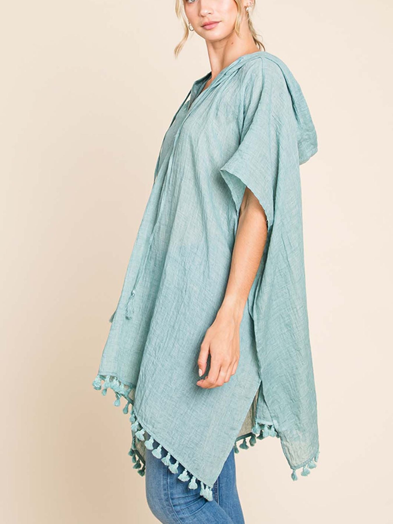 Lightweight And Flowy, This Oversized Kimono Wrap Features a Boho Chic Design with a Hood And Tassel Trim, Perfect for Summer Pool Days And Beach Vacations in Mint Green